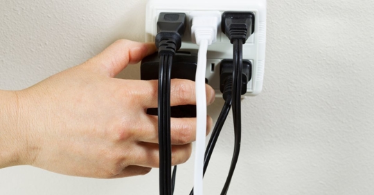 extension cords plugged into outlet
